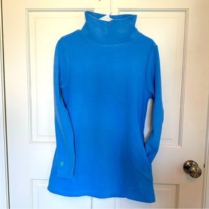 Dudley Stephen’s blue turtleneck